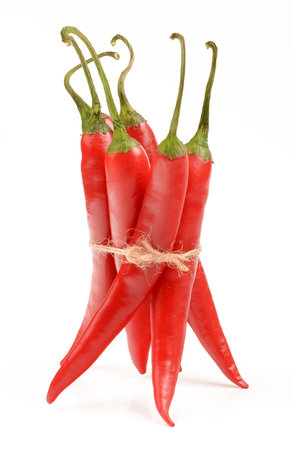 red hot chili peppers isolated on white backgroundの写真素材