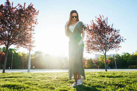 Fashion shine young girl enjoy life, laughing, joy on the streetの写真素材