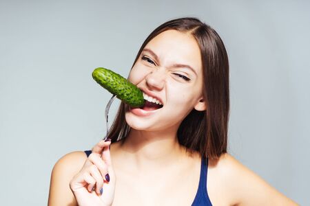 girl in a blue shirt is a pickled cucumberの写真素材