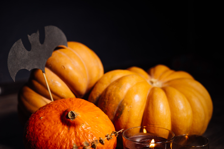 a composition for decorating a house for halloween, lie yellow and orange pumpkins, candles burnの写真素材