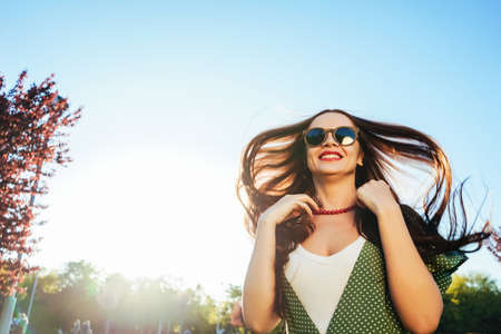 Happy smiling shine young girl,joy,enjoy life,freedom summer shine conceptの写真素材