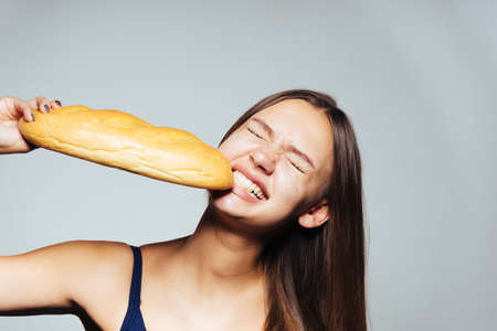 a young girl wants to lose weight, but eagerly eats harmful calorie white bread