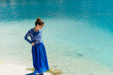 Young beauty woman at the beach,blue water summer backgroundの写真素材