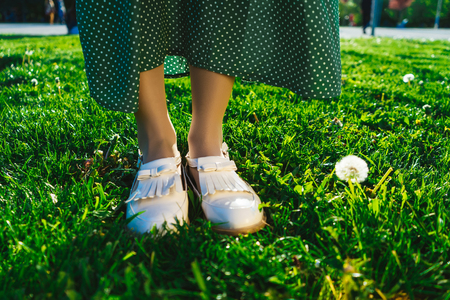 Backgroung for inspiration and motivation summer text,legs on grass closeupの写真素材