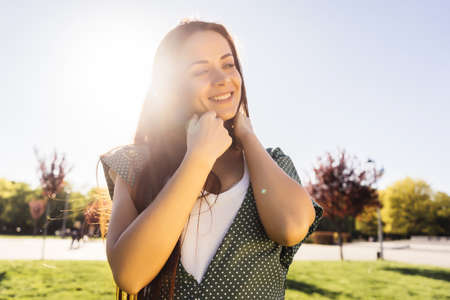 Happy woman enjoying freedom and summer sun