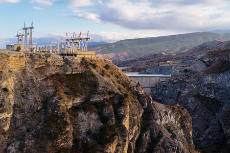 majestic view of high mountains and cliffs, electric station on sky backgroundの写真素材
