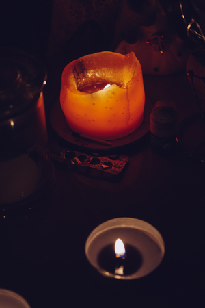 In the dark, aromatic candles burn to create a relaxing atmosphereの写真素材
