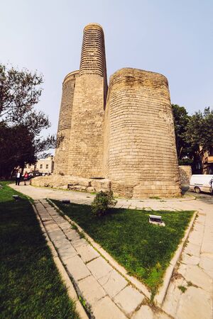 an unusual ancient building made of bricks against the blue sky
