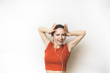 Happy success woman win opportunity, back, earphonesの写真素材