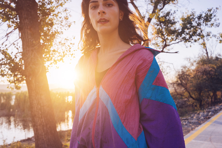 girl on a sunny morning walk near the lakeの写真素材
