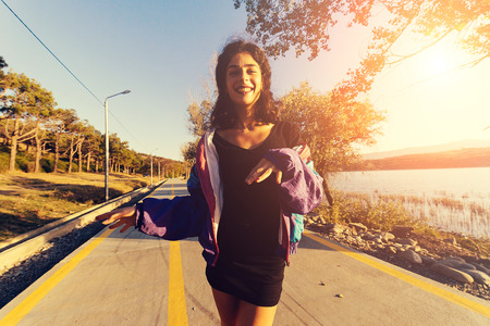 happy young woman on the background of the track