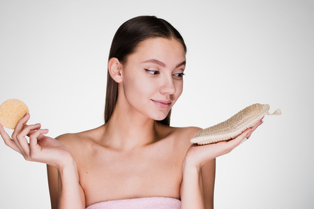 woman with long hair holds a sponge in her handsの写真素材