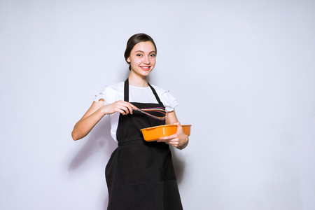 young woman cook preparing a delicious pie for dinnerの写真素材