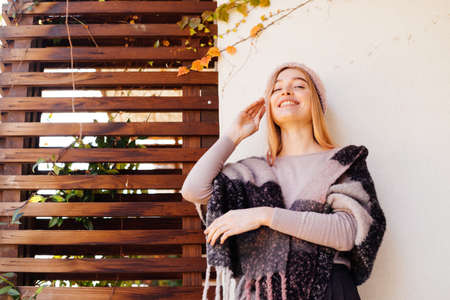 happy beautiful woman posing at the camera, street fashionの写真素材