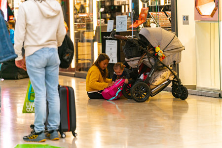 4.10.2021 Milan, Italy - Milano Centrale railway station. Children are waiting for the train at the...