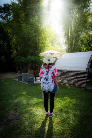 back of women standing in garden