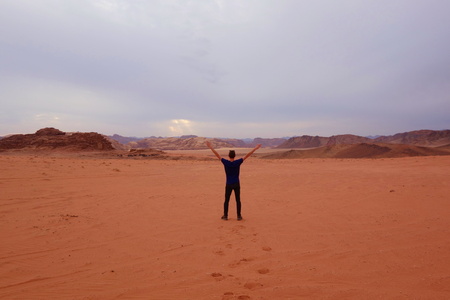 Jordanian desert called Wadi Rum with a young man.の写真素材