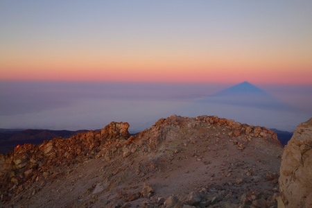 Sunrise with a shadow of a volcano Pico Del Teide in Tenerife, Canary islands, Spain, Europeの写真素材