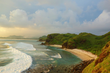 Colorful sunset at Merese Hill with a view of Tanjung Aan in Lombok, Indonesia, South-East Asia