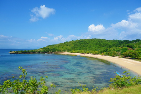 Beautiful landscape of Pantai Nipah, Lombok island scenic travel destination beach with crystal blue waters and coconut trees - near Bali, Indonesia, South-East Asiaの写真素材