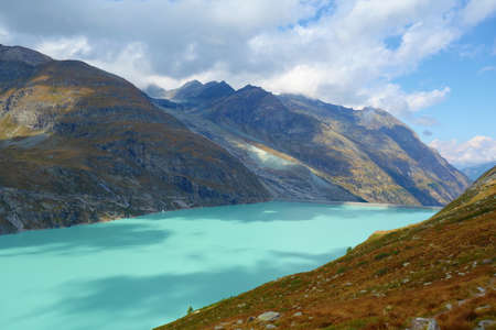 Mountain lake Mattmark (Stausee Mattmark) in Saas Valley surrounded by glaciers next to Zermatt, Switzerland, Europeの写真素材