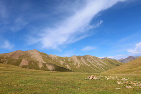 Second stage of Ak-Suu Traverse trek from Ailampa lake to Boz Uchuk lake, Karakol, Kyrgyzstan, Central Asia: A perfect snapshot of adventure and untouched beautyの写真素材