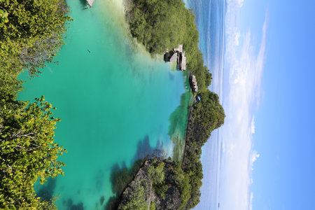 Aerial view of Rufas island with its lagoon in the middle located in Raja Ampat, West Papua, Last...