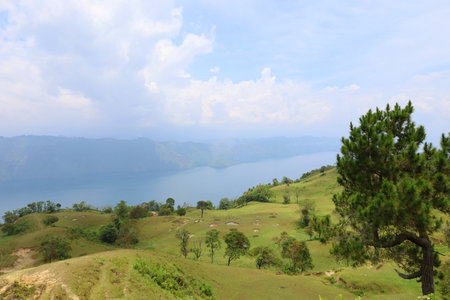 Stunning scenery of volcanic lake Toba - largest and deepest crater lake in the world located in North Sumatra, Indonesia, SE Asiaの写真素材