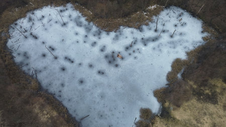Aerial view of Karvinske srdce a heart shaped lake created by land subsidence after coal mining near Karvina Czech Republicの写真素材
