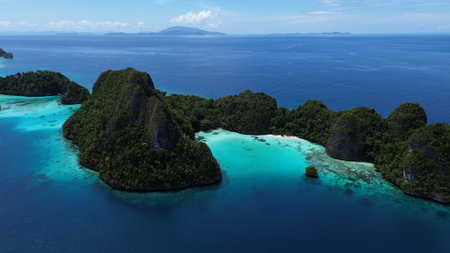 Remote lagoon at Wayag island consisting of limestone islands, Raja Ampat, West Papua, Indonesia, part of the Raja Ampat Marine Protected Areaの写真素材