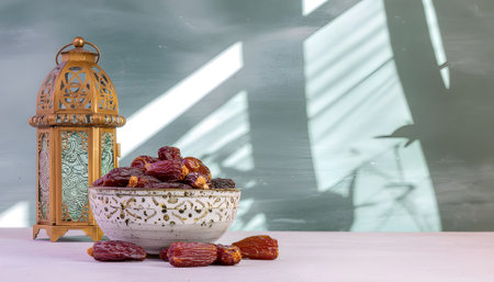 Ramadan Feast Dates and Lanterns with Shadows on a White Surface, Celebration Timeの素材