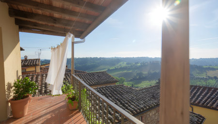 Balcony Serenity Capturing the Breathtaking Tuscan Landscape Under a Sunny Skyの素材