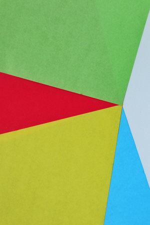 Bold and energetic abstract layout featuring overlapping paper shapes in red, yellow, and orange. Dynamic design ideal for packaging or eye-catching digital content.の写真素材