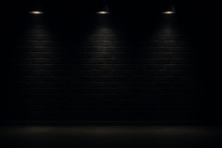 Dark background with spotlight illumination on textured wall and floor, creating an atmospheric and dramatic scene suitable for product displays or event backdropsの素材