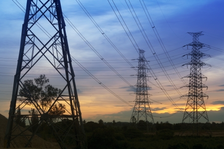 Electrical transmission tower with sunset background.