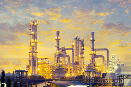 Distillation tank of oil refinery plant, twilight time 