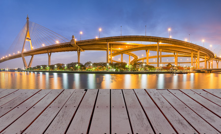 Highway bridge with street light reflect in water at night の写真素材
