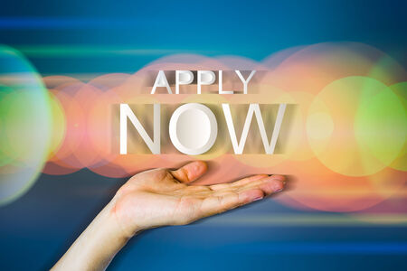 Concept apply job in hand with modern dark background.の写真素材