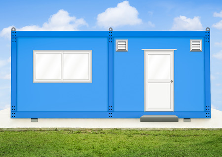 Blue container house on concrete pedestal with sky background.の写真素材
