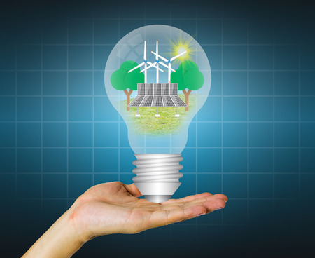 Hand hold alternative energy in bulb.の写真素材