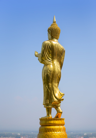 Big buddha image in Wat phra that khao noi with blue sky background.の写真素材