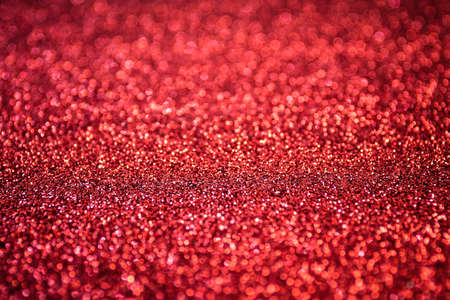 Glitter and bokeh for festival background, red color.の写真素材