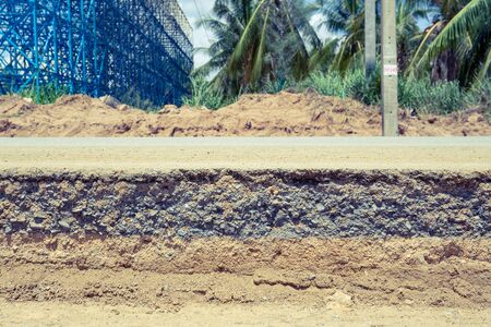 Asphalt road damage and repair work.