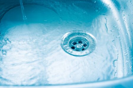 Clean and purity water drop in sink.