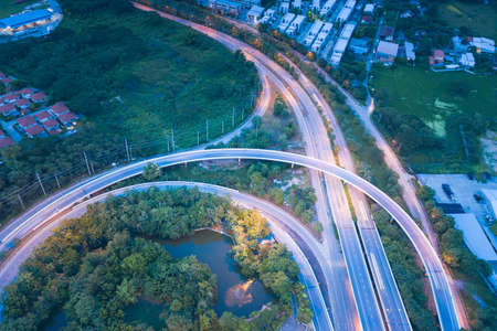Aerial view of higway road and movement vehicle in Chiang Mai city of Thailand at twilight.の写真素材