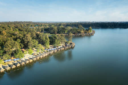 Landscape of Huay tung tao lake in Chiang Mai in aerial view. Floating restaurant with beautiful scenery consist of tree, forest, water and bamboo hut, bungalow, shack or cabin for travel, vacation.の素材 [FY310175619013]