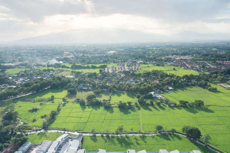 Land or landscape of green field in aerial view. Include agriculture farm, house building, village. That real estate or property. Plot of land for owned, sale, rent, buy, purchase and investment.の写真素材