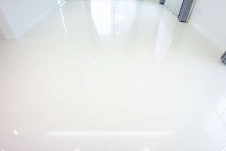 White tile floor with grid line of square texture pattern in perspective. Clean shiny of ceramic...
