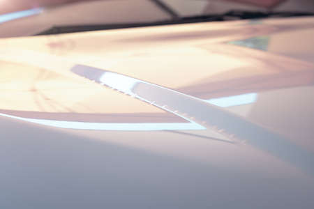 Close up of film wrap on auto car vehicle with bubble problem. Vinyl foil with adhesive for...
