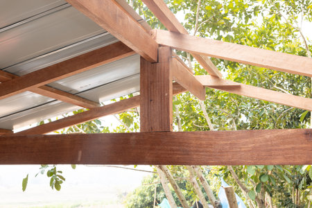 Wood connection joint in roof structure under construction consist of king post, ridge, rafter,...
